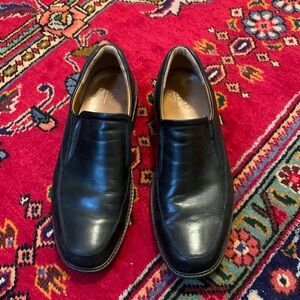 Black leather ECCO shoes.